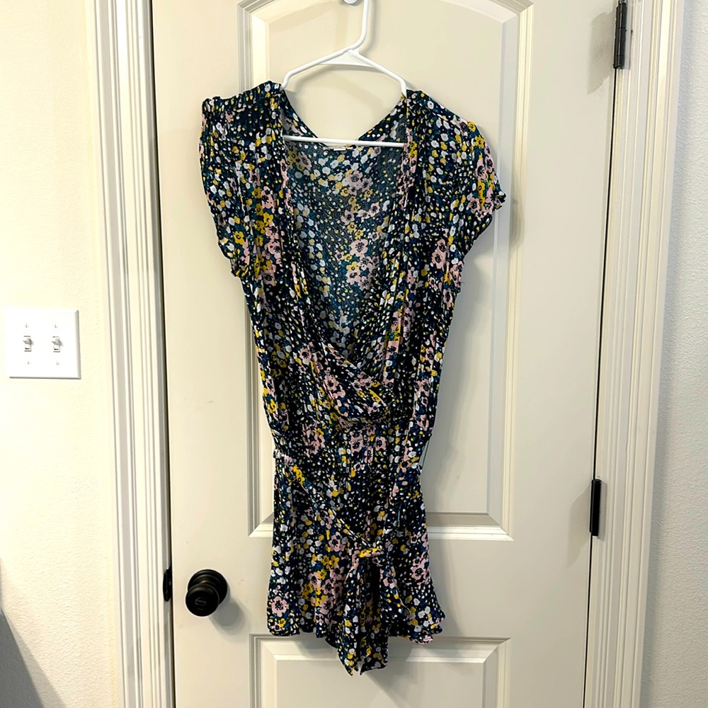 Navy floral romper. From Loft. Size Large. Ruffle sleeve.